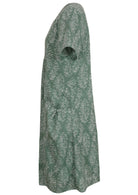Side view of cotton dress with round neckline and short sleeves in sage green based floral print. 