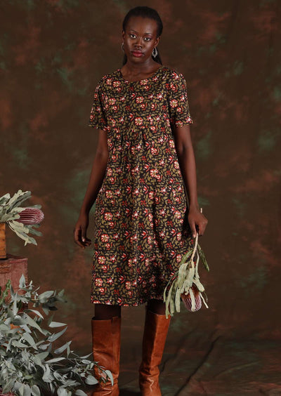 Model wears a round neck 100% cotton dress