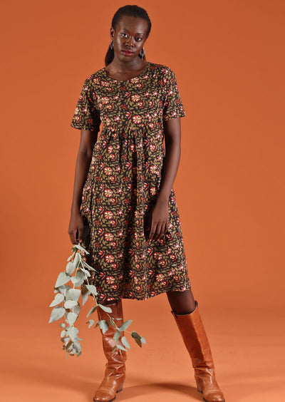 Model wears 100% cotton floral dress