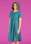 Woman in teal polkadot print cotton relaxed fit dress