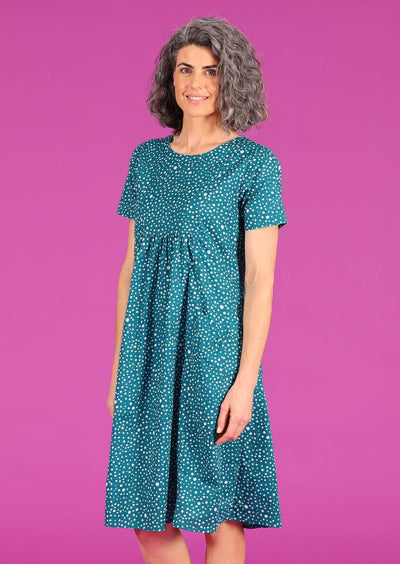 Woman in teal polkadot print cotton relaxed fit dress