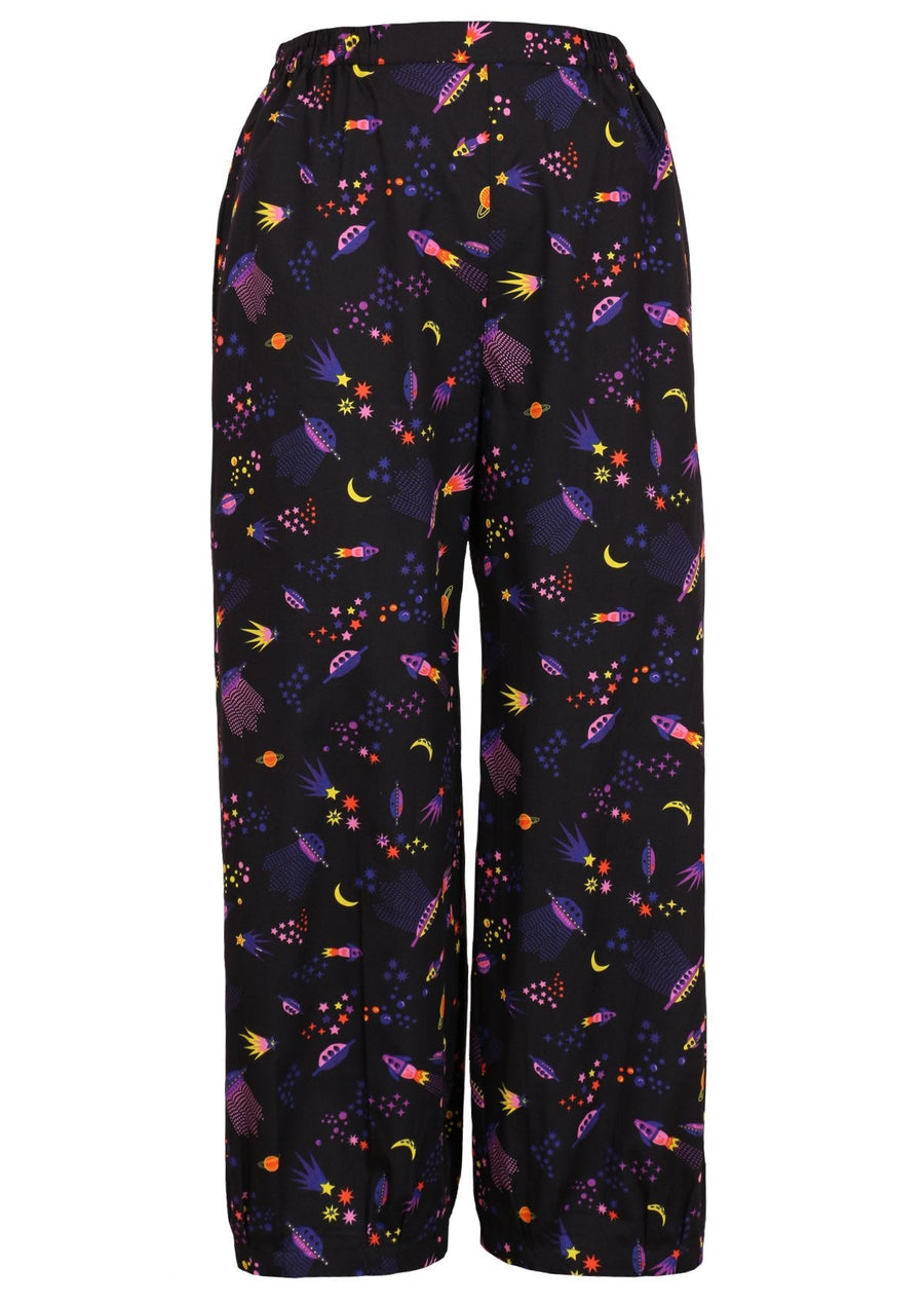 Greta Pants Astro 100% cotton colourful space themed print on black base loose fit pants with tapered ankles and pockets | Karma East Australia