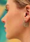 Model wears sterling silver mandala earring with clasp