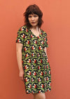 Model wears green and black print loose fit cotton dress