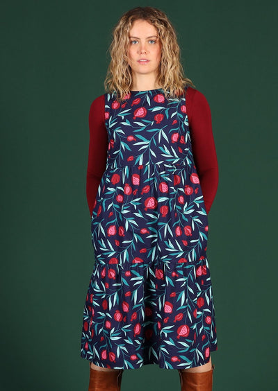 Woman wears relaxed fit dress.