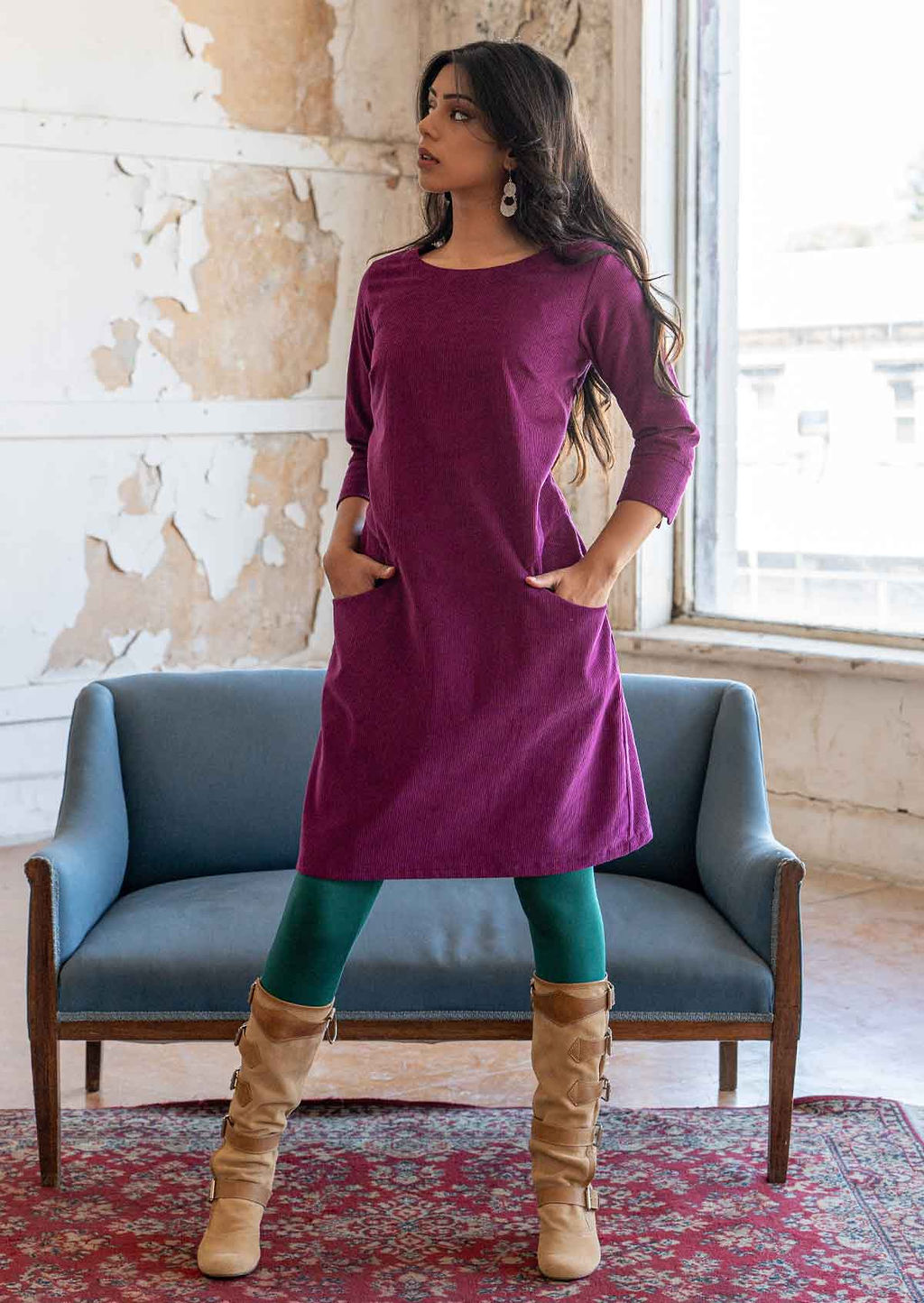 Woman wearing 100% cotton 3/4 sleeve corduroy shift dress with hands in pockets