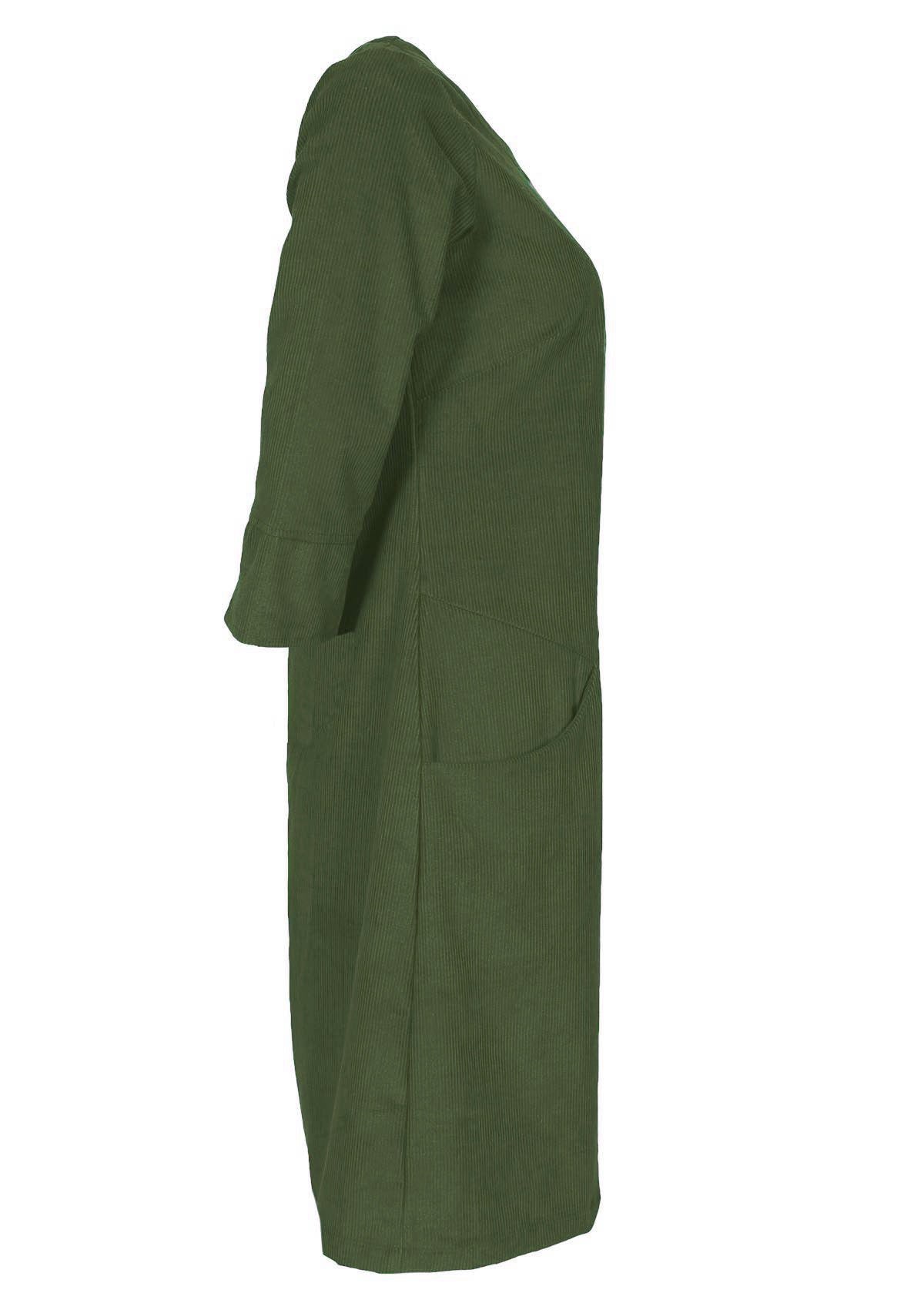 Side photo of green corduroy A-line dress with 3/4 sleeves and pockets