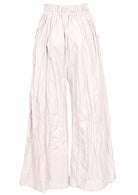 Back view of cotton wide leg pants in natural white with elasticated waist and pockets