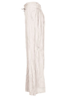 Natural white 100% cotton wide-leg pants with elastic back waist and pockets.