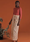 Model wears cotton wide leg pants with floral print on light base