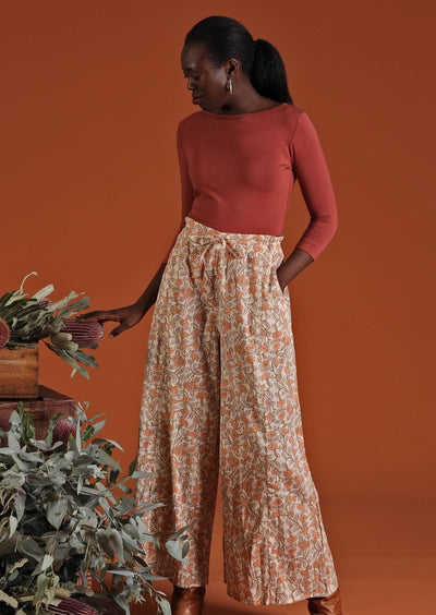 Model wears long cotton lightweight wide leg pants