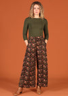 Model in Janis Pants Wild Rose wide legged cotton women's pant with pockets and long sleeve green top