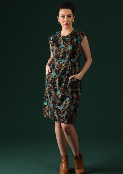 Women wears knee length black base dress.