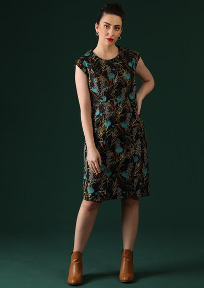 Women wears dress with a slight A-line skirt.