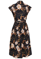 Back view of black based floral print cotton cap sleeves dress.