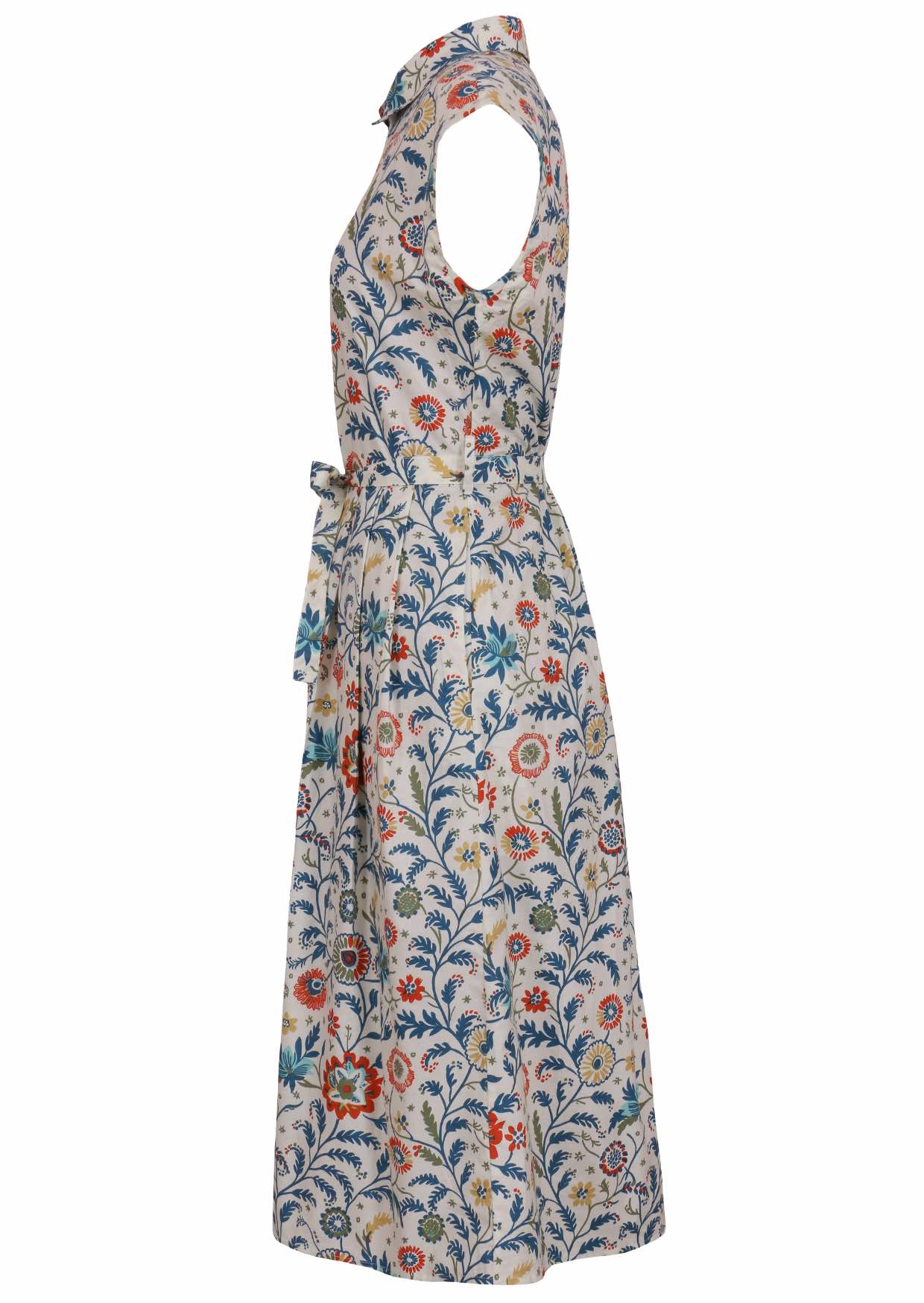 Side view of white based floral print cotton dress with pockets.