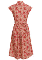 Back view of cream based floral print cotton cap sleeves dress.