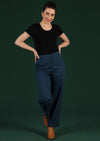 Model wears blue drill cotton straight leg pants