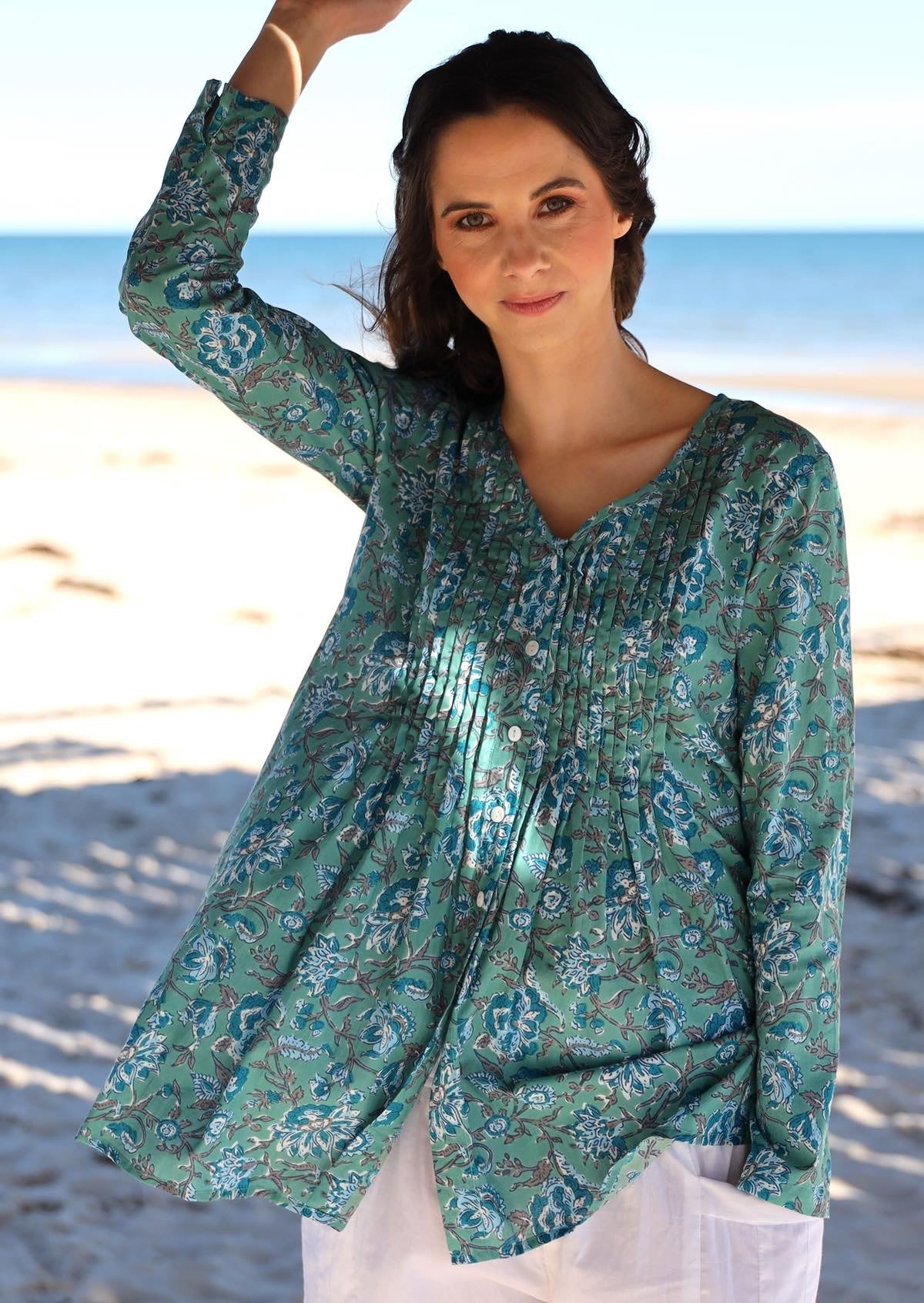 Floral printed button through cotton top with long sleeves and V neckline.