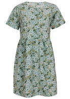 100% cotton above knee length loose fitting dress with short sleeves and high round neckline in sage green based floral print