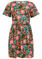 100% cotton above knee length loose fitting dress with short sleeves and high round neckline in olive green based floral print