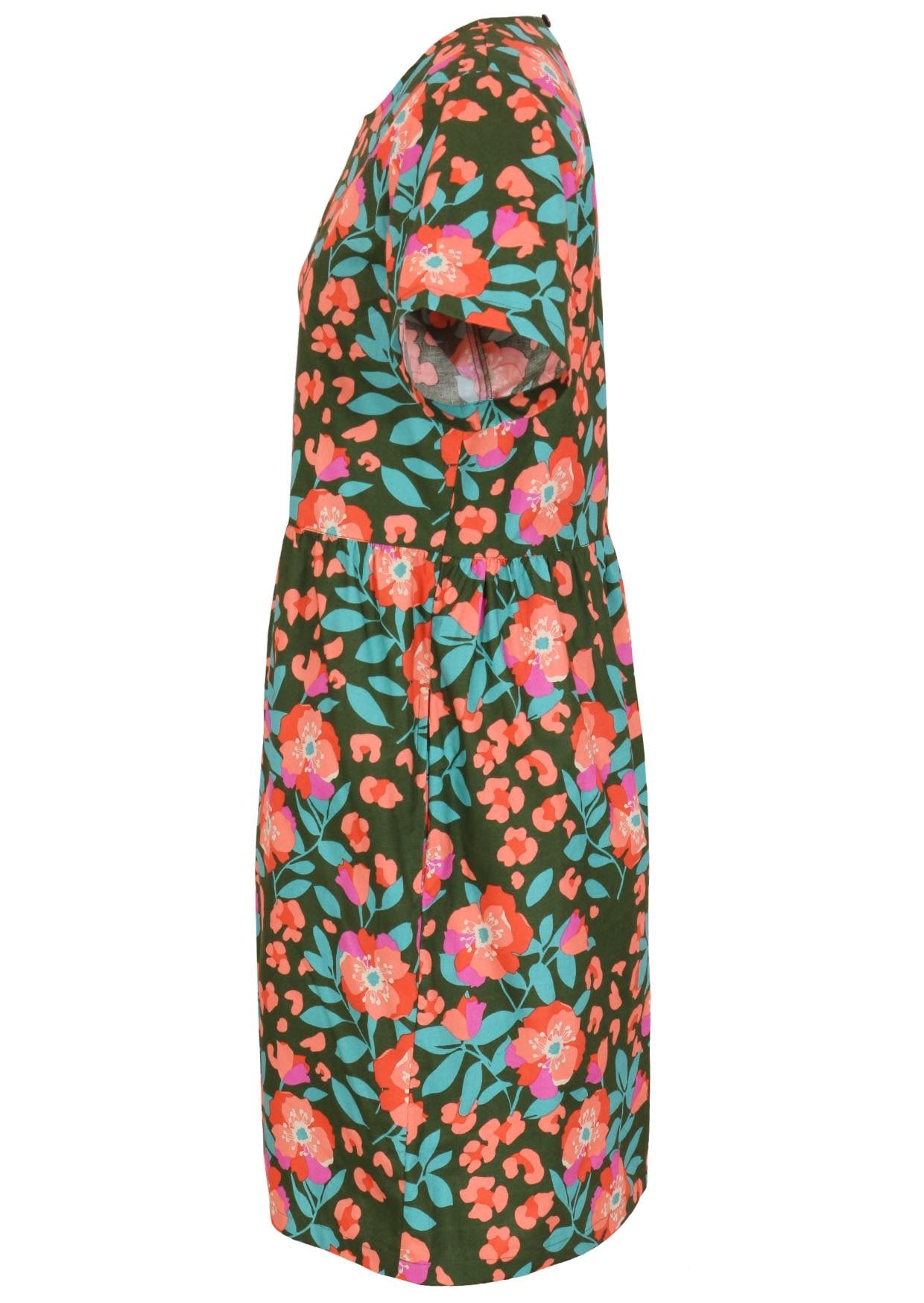 Side view of loose fitting cotton dress in olive green with short sleeves and hidden side pockets 
