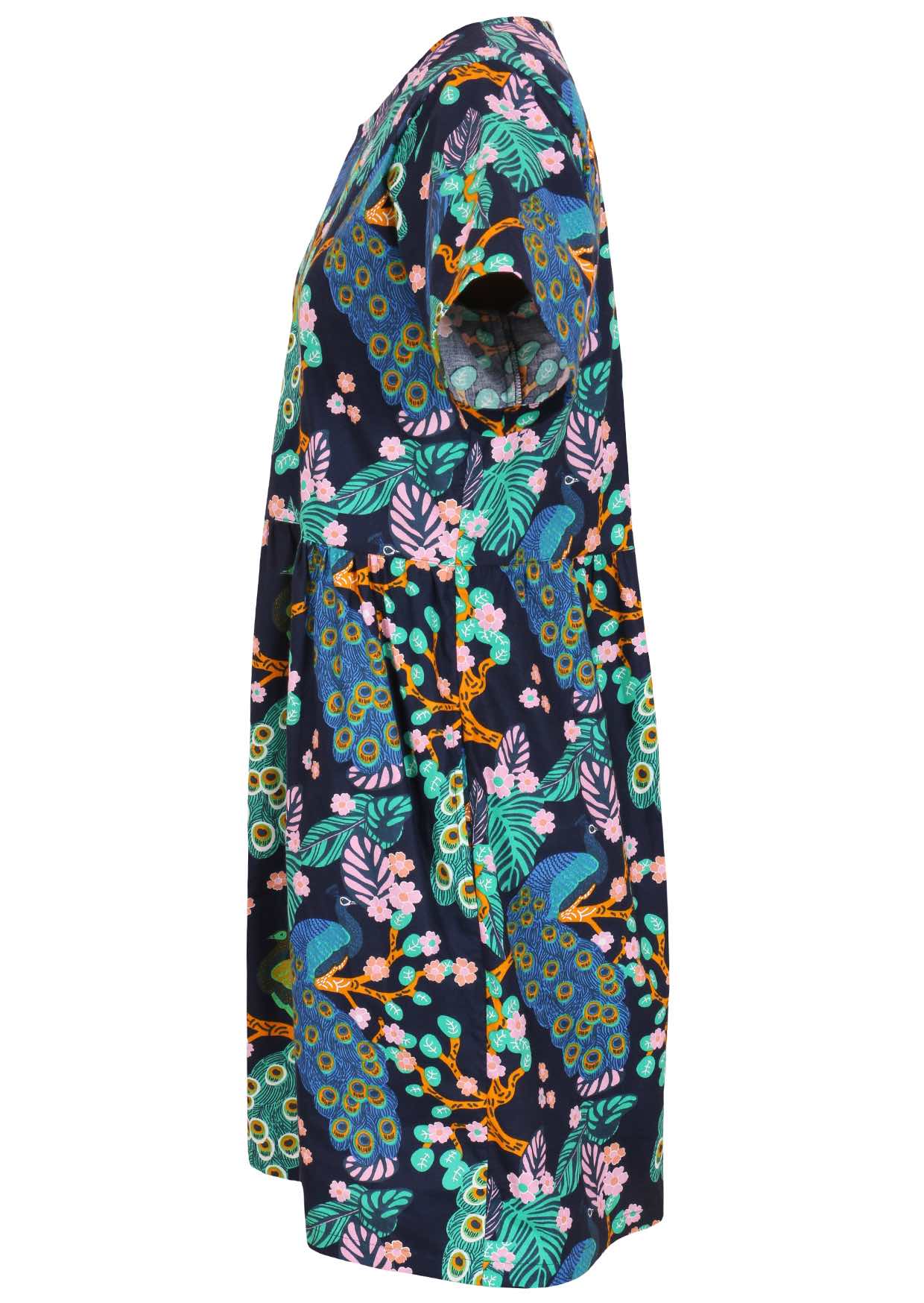 Side view of loose fitting cotton dress in navy blue with short sleeves and hidden side pockets 