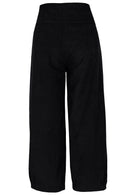 Back view of black cotton corduroy wide leg pants with pleat at ankle and wide waistband