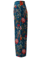 Side view of deep teal based multi-colour floral velvet wide leg full length pants with pockets and a side zip