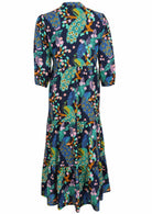 Back view of navy blue based floral printed cotton maxi dress with mandarin collar and 3/4 sleeves