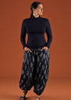 Model wearing Pilot Pant Delphi navy blue harem pant with pockets