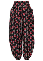 Black based floral print cotton harem pants with buttoned ankles with pockets.