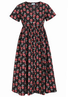 Front view of black based floral print V-neck cotton dress.