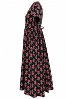 Side view of black based floral print V-neck cotton dress with pockets.