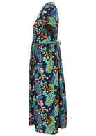 Side view of navy blue based floral print V-neck cotton dress with pockets.