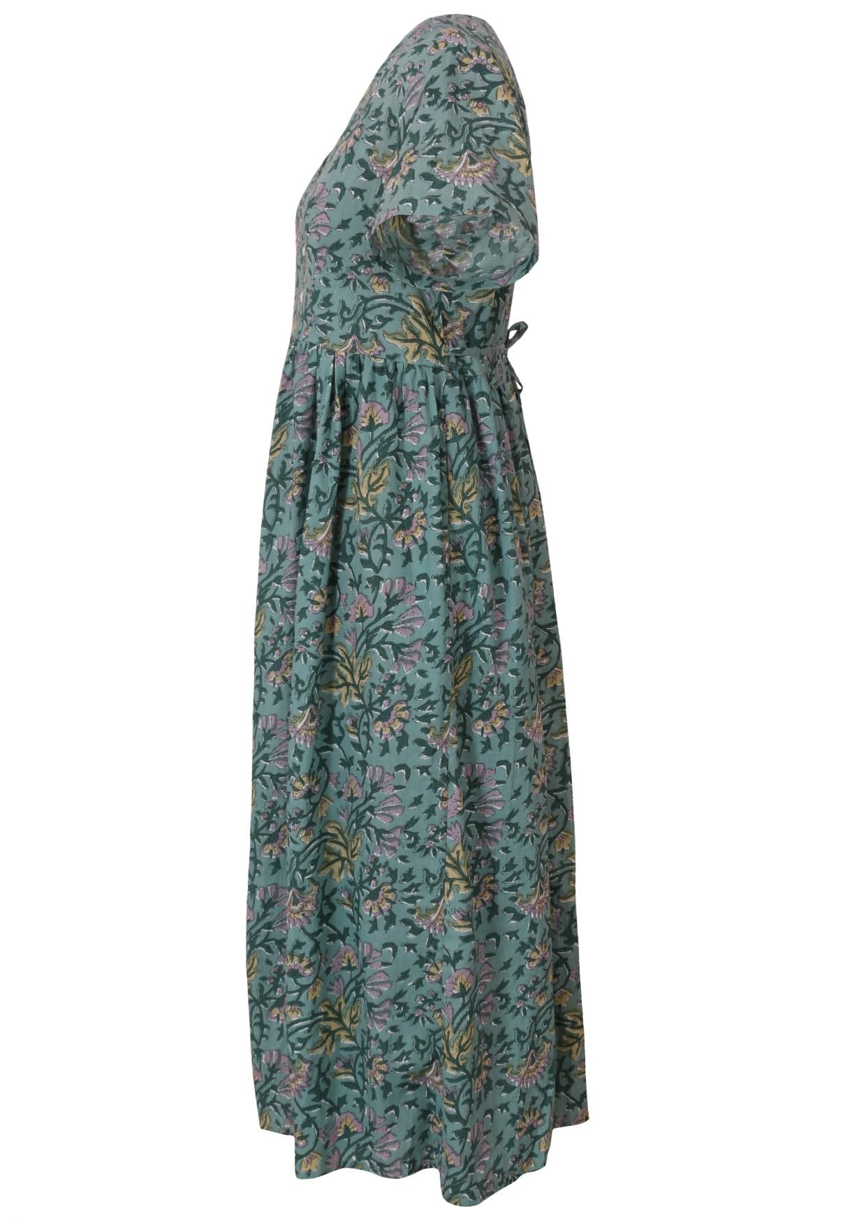 Side view of relaxed fit floral cotton dress with short sleeves, small gathers at the waist and shoestring tie