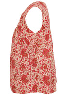 Cap sleeves cotton top with cream based warm floral print on a white background