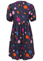 Back image of navy blue spotty print cotton dress with elbow length sleeves.