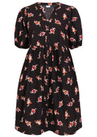 V-neck cotton dress with black based floral print.