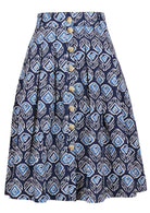 100% cotton knee length button through skirt with box pleats and belt loops in navy blue based floral print