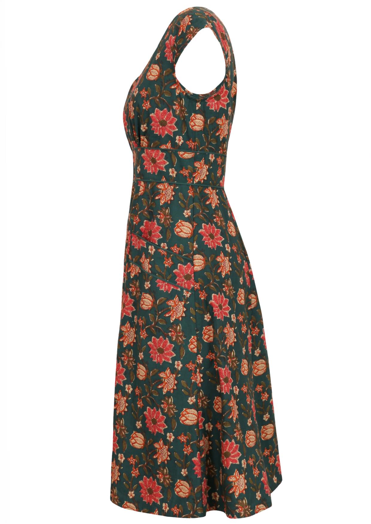 100% cotton dress in dark green based floral print with cap sleeves, piped details and pockets.