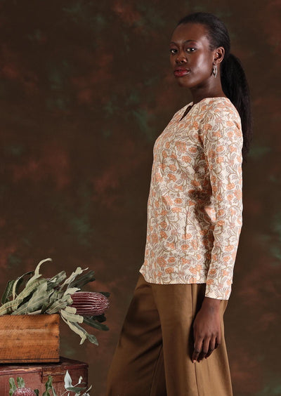 Side view of model in cream floral Sophia Blouse in Liberty print