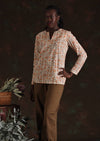 Model in cream floral Sophia Blouse in Liberty print with tan cotton drill pants