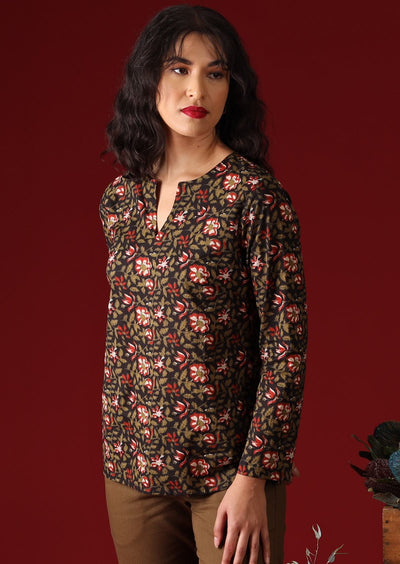 Dark haired model wearing Sophia Blouse Wild Rose black floral cotton women's top