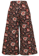 Back view of cotton wide leg printed pants  in 3/4 length with pockets and side zipper