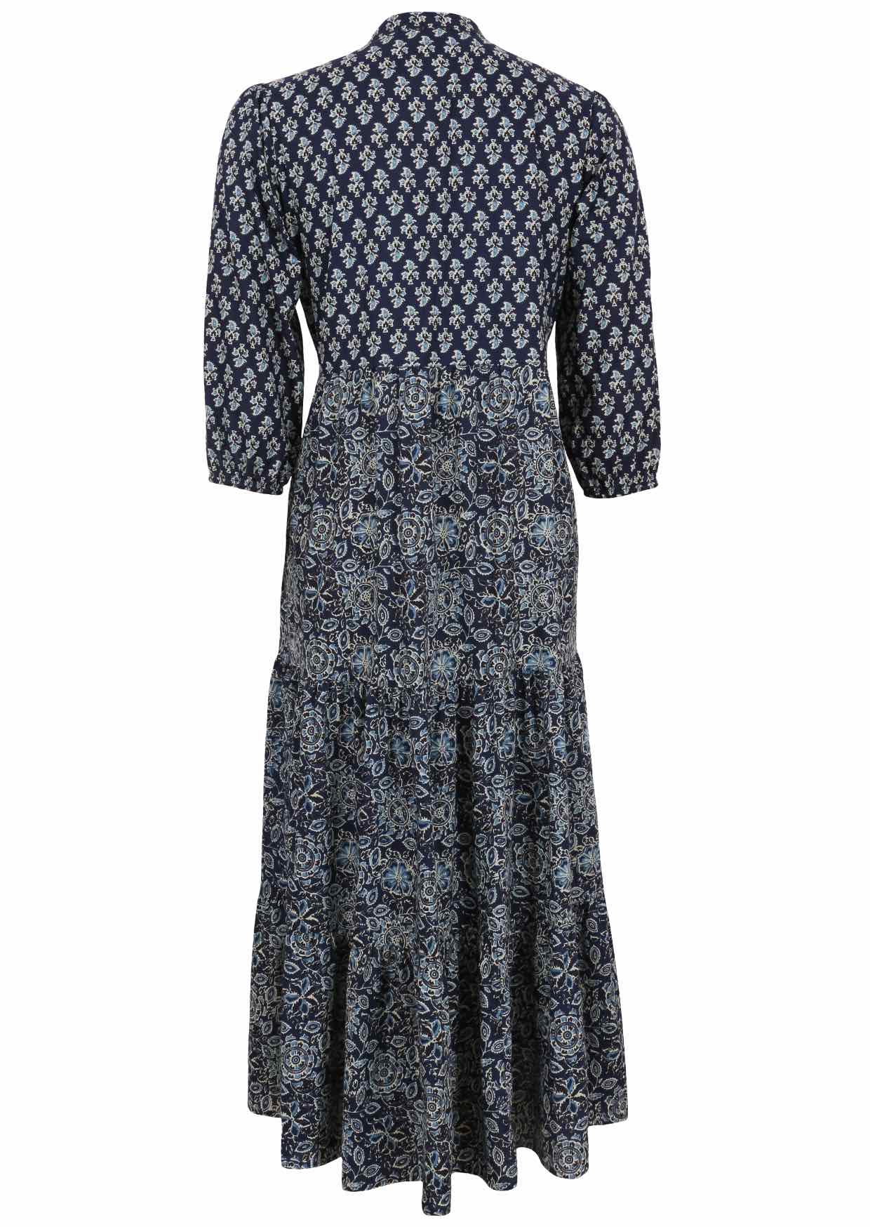 Back view of a full length maxi dress with 3 tiered flowy skirt, mandarin collar, buttoned bodice and pockets