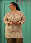 Size 18 woman wearing long sleeve cotton floral tunic top