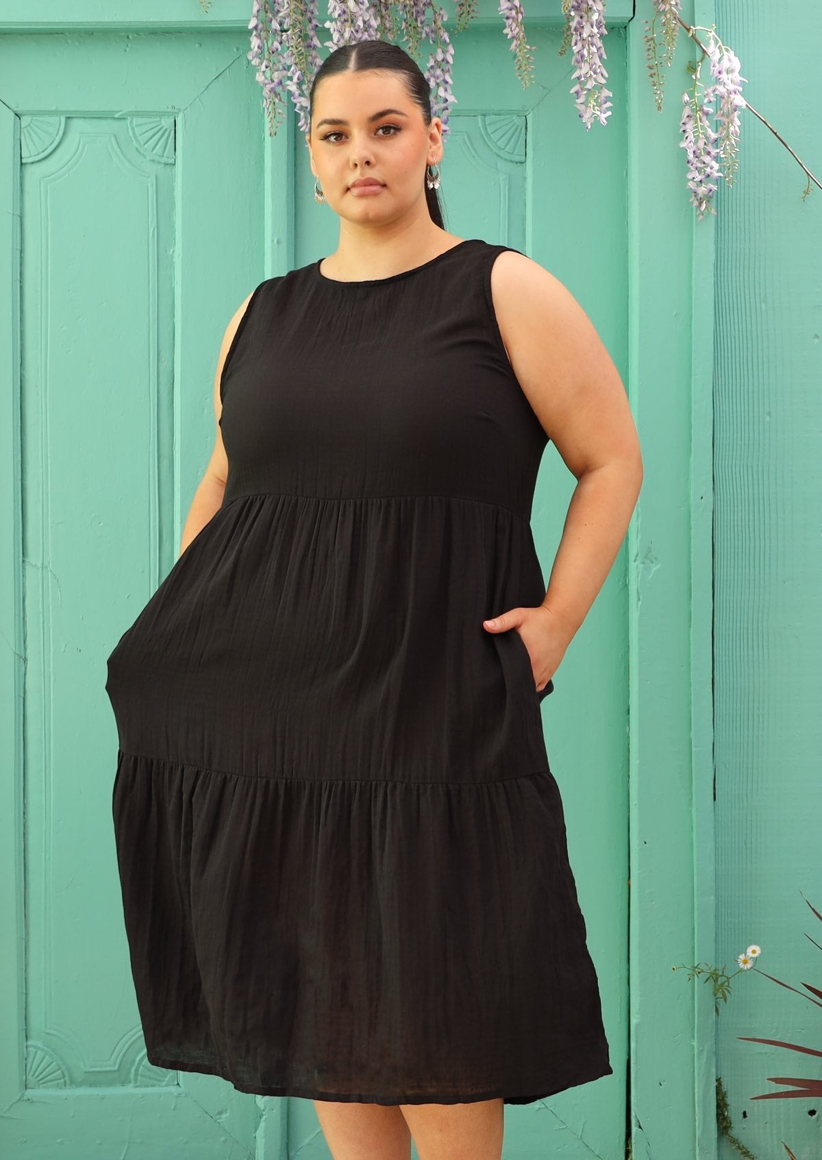 Plus sized woman wearing cotton black dress