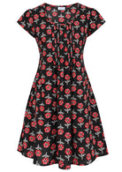 Front mannequin photo of cotton above knee dress in black based floral print.