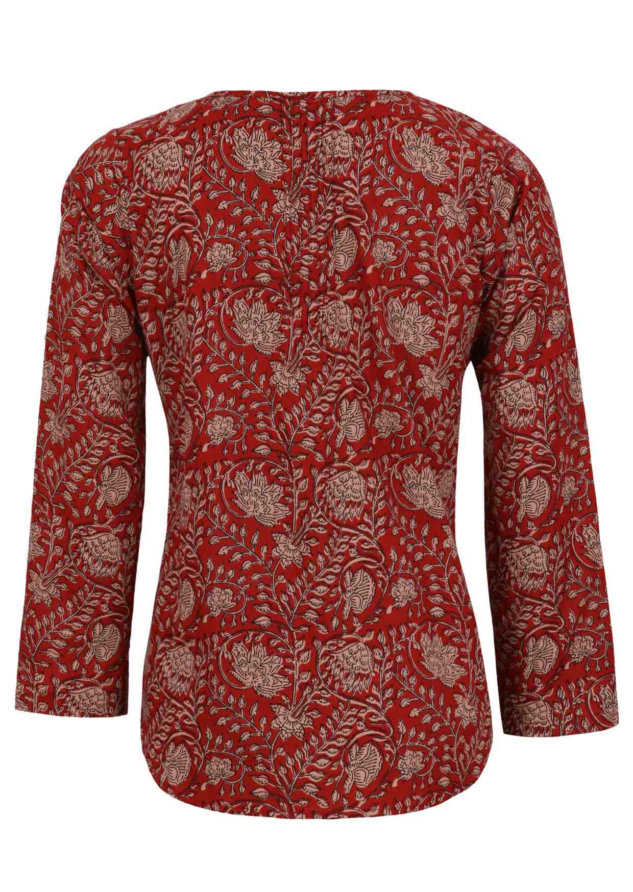 Back image of long sleeve cotton top with red based floral print.